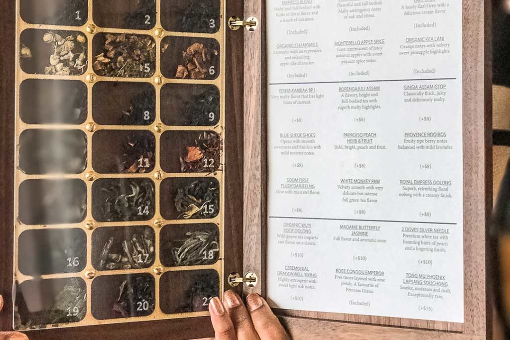 Tea at the Fairmont Empress is ordered from a beautiful wooden menu with teas peering out from behind little "window panes."