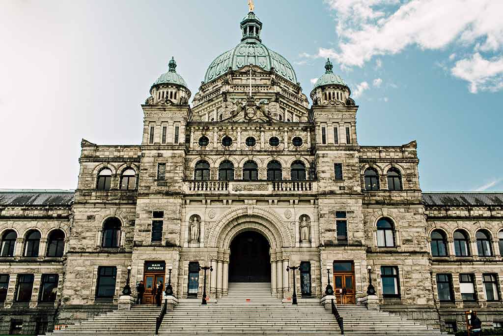Check the impressive architecture on Victoria's 19th Century Parliament Buildings during your family vacation. Credit: Destination BC