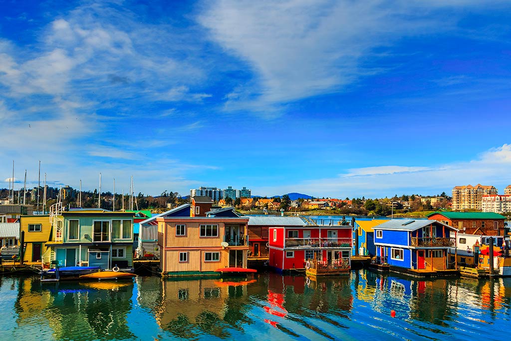 Wander through a colorful collection of floating houseboats along Fisherman’s Wharf on your family vacation. Credit: Erik Lawrenz