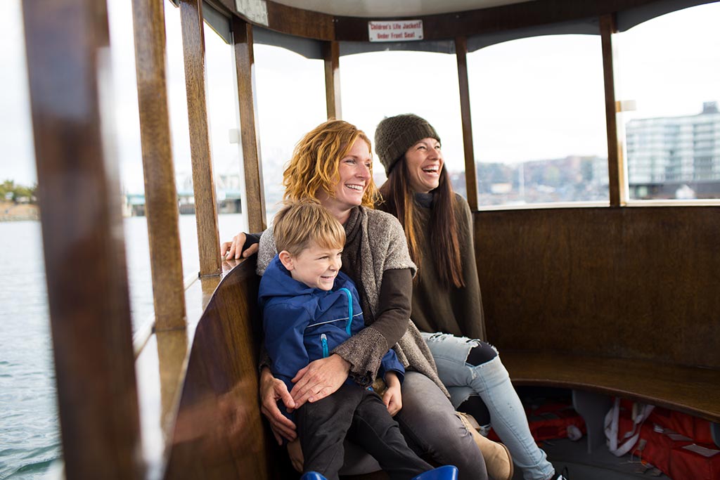 Hop on one of Victoria’s cute Harbour Ferries and zip across the Inner Harbour on your family vacation. Credit: Destination Greater Victoria