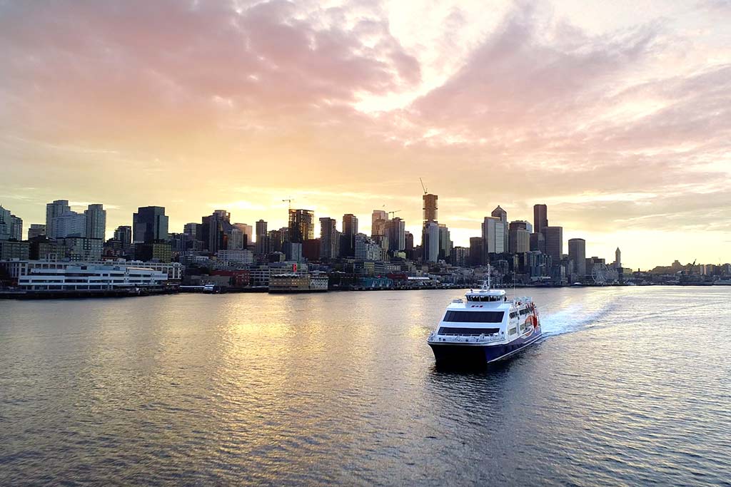 Catch a stunning sunrise as you cruise out of Seattle's Pier 69 on the Victoria Clipper ferry.