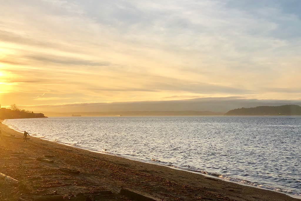 Stroll along miles of pristine sandy beach in West Seattle. Credit: Scott Meis