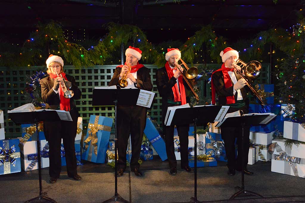 Listen to the brass band play among the trees at The Butchart Gardens. Credit: The Butchart Gardens